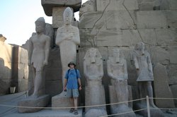 Alex standing next to a few of the many statues