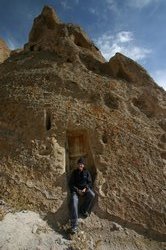 Alex outside a fairy chimney house in Kandovan