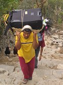 Porters carrying Korean Trekkers luggage around the mountains