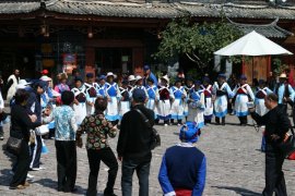 Dancing for and with the tourists at the Old City of Lijiang