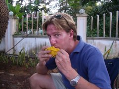 Me eating, for a change. This time it's a mango