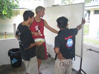 Che, Christophe and onen of the boat boys planning the COT clean up sites