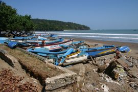 Broken boats on the beach at Pangandaran