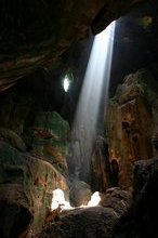 Sun rays penetrate Niah Caves